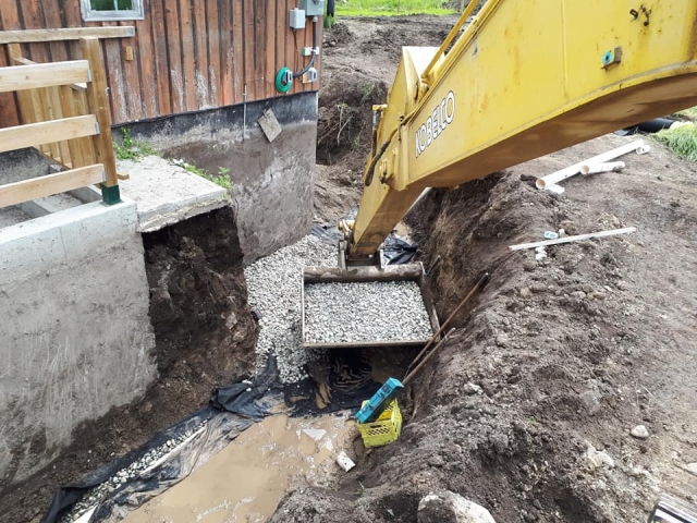 A close look at the excavator digging the land